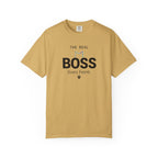 A tan crewneck t-shirt with a graphic print on the front that reads 'THE REAL BOSS lives here.' with a small cat silhouette and paw print, displayed on a clean white background.