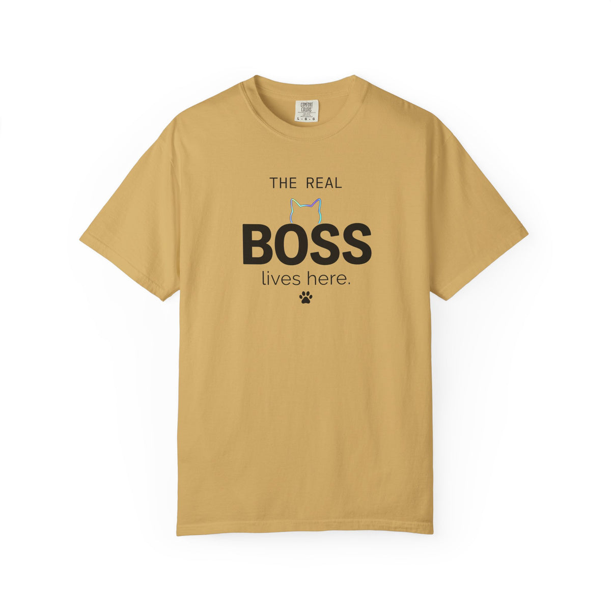 A tan crewneck t-shirt with a graphic print on the front that reads 'THE REAL BOSS lives here.' with a small cat silhouette and paw print, displayed on a clean white background.