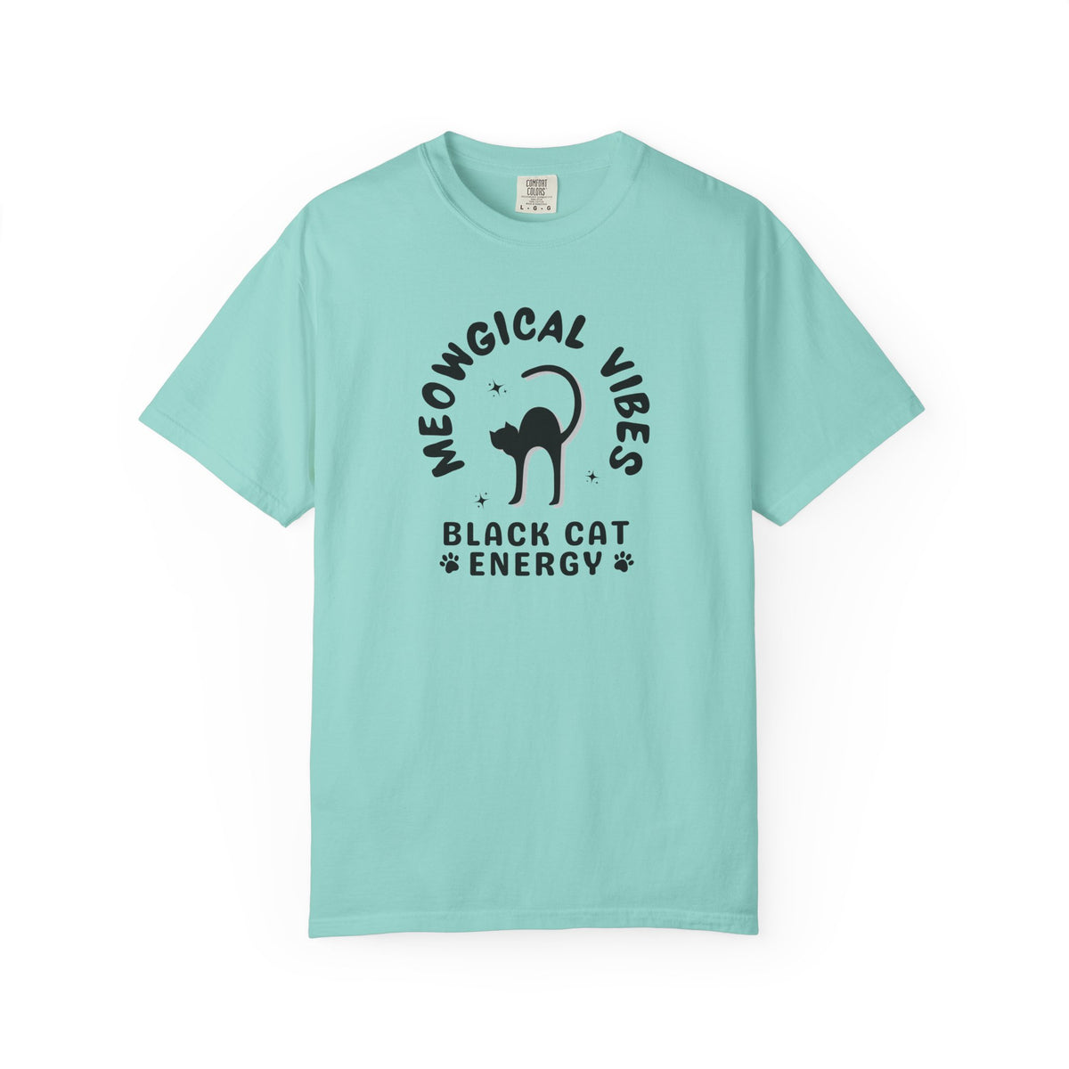 A light aqua blue short-sleeve t-shirt with a black graphic print on the front. The graphic features a black cat silhouette inside the text 'MEOWGICAL VIBES' arched above, and 'BLACK CAT ENERGY' with paw prints below.
