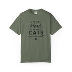 Green t-shirt with raccoon graphic and 'The Scavengers 100% Wild' text on a white background