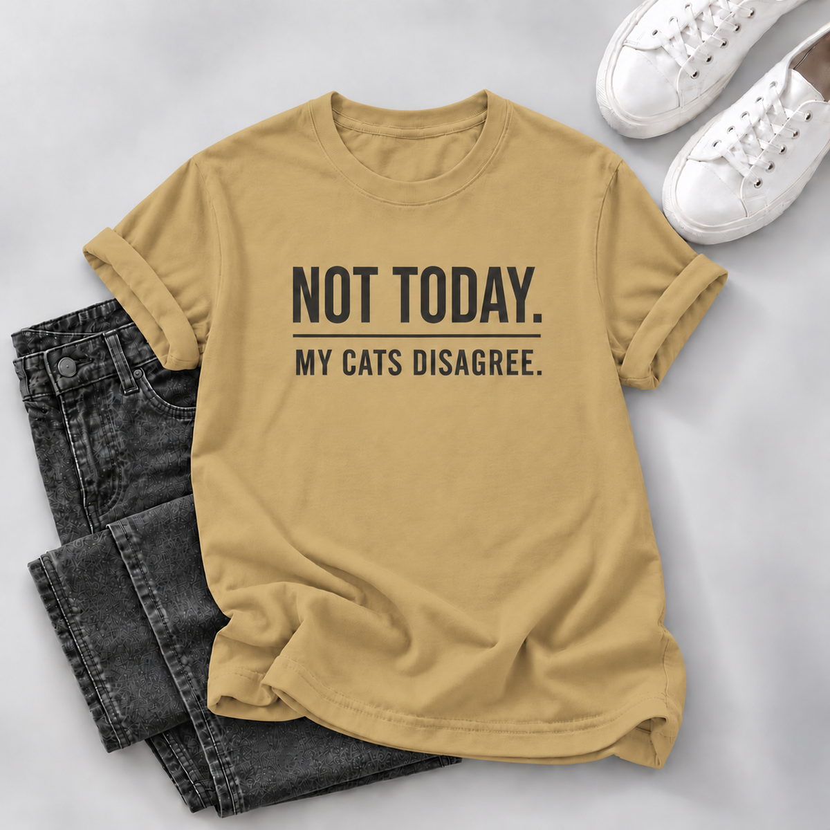 A yellow graphic t-shirt with the text 'NOT TODAY. MY CATS DISAGREE.