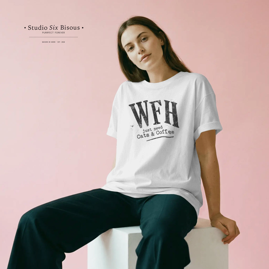 Woman wearing a white t-shirt with 'WFH just need Cats & Coffee' text on a pink background