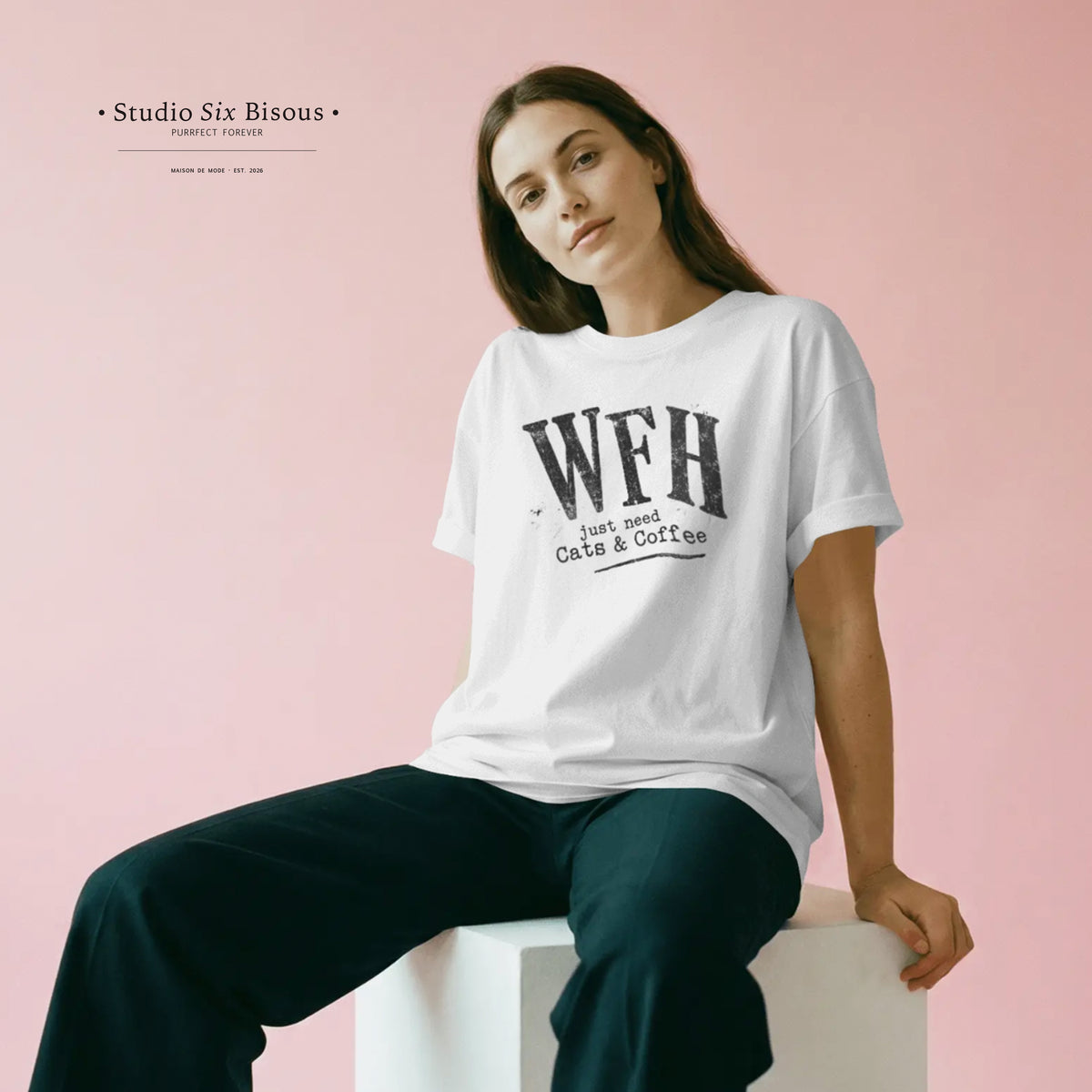 Woman wearing a white t-shirt with 'WFH just need Cats & Coffee' text on a pink background