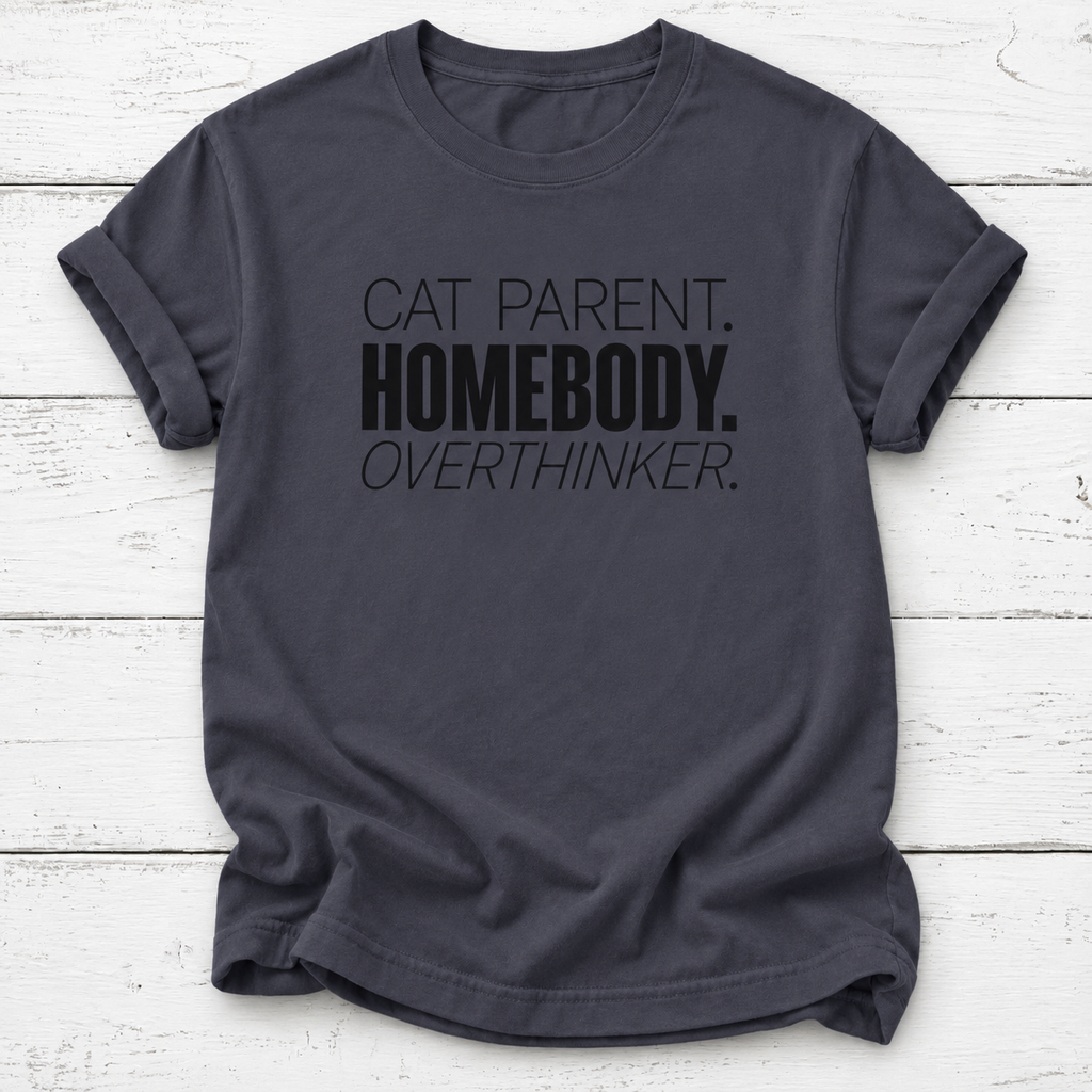 A navy gray t-shirt with black printed text reading 'CAT PARENT. HOMEBODY.