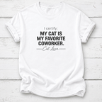 A white short-sleeve crewneck t-shirt with black printed text reading 'I certify: MY CAT IS MY FAVORITE COWORKER. Cat Lover' laid flat on a white wood plank background.