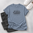 A light blue graphic t-shirt with the text 'I certify: MY CAT IS MY FAVORITE COWORKER. Cat Lover' printed in black.